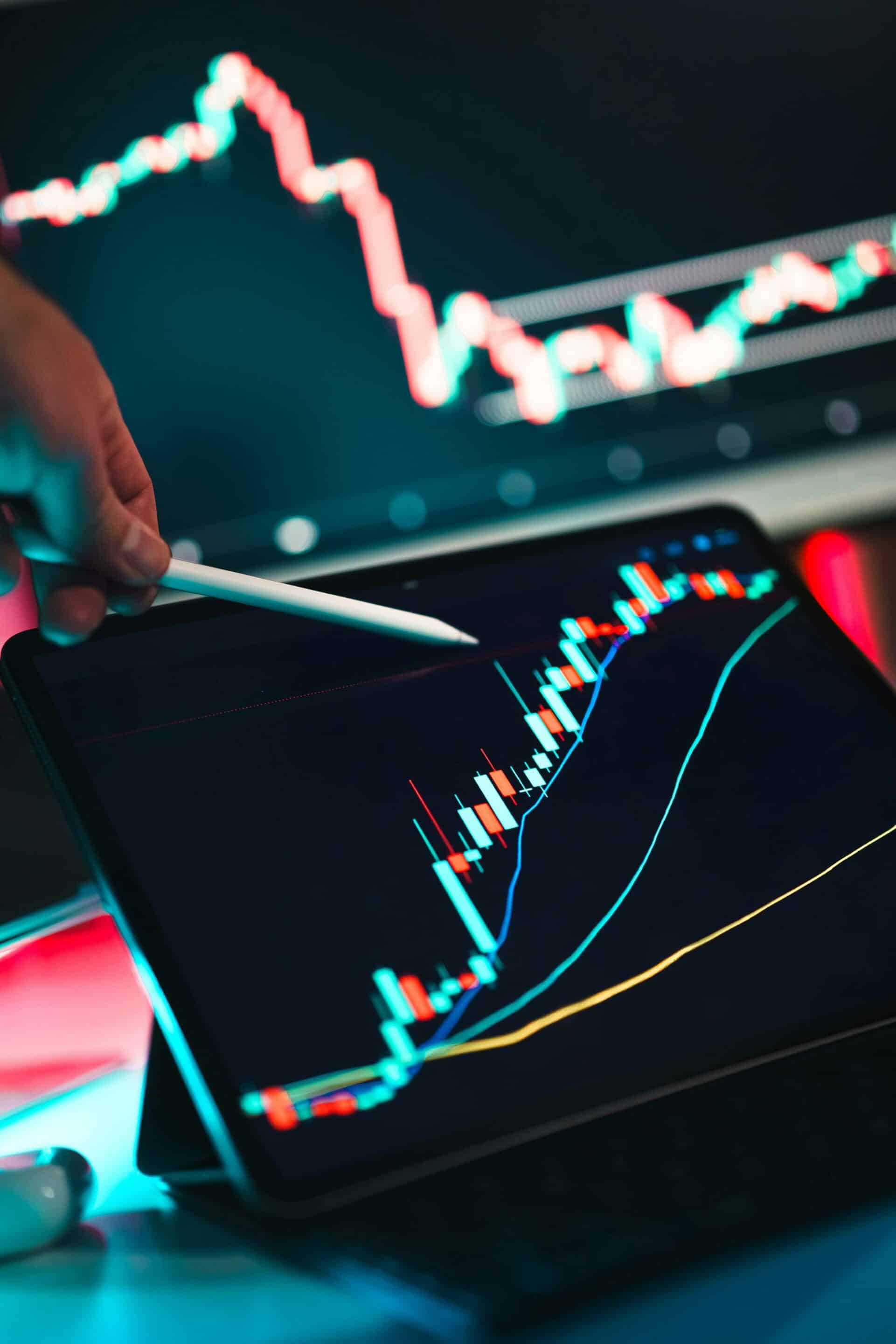 Hand using a stylus on a tablet displaying rising performance charts and data graphs, symbolizing Google Business Profile optimization and AI-driven local SEO growth for businesses in Grand Rapids, Detroit, and Marquette.