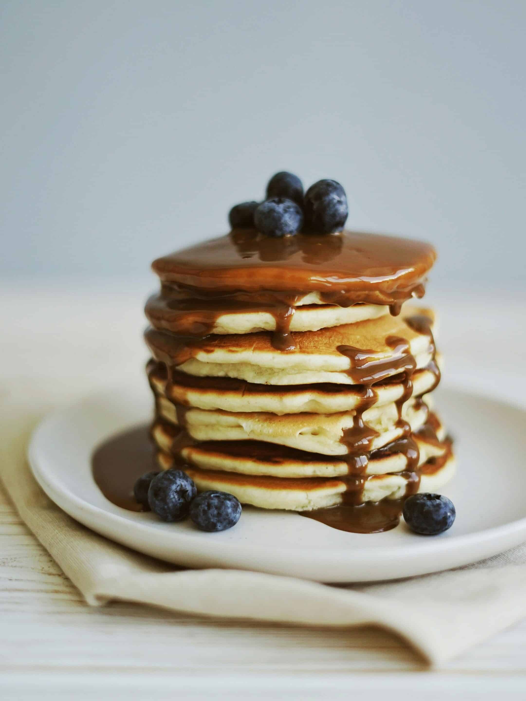 Stack of pancakes layered with syrup symbolizing the layered AI optimization strategy used by Cotes Code for businesses in Grand Rapids, Ada, and surrounding West Michigan